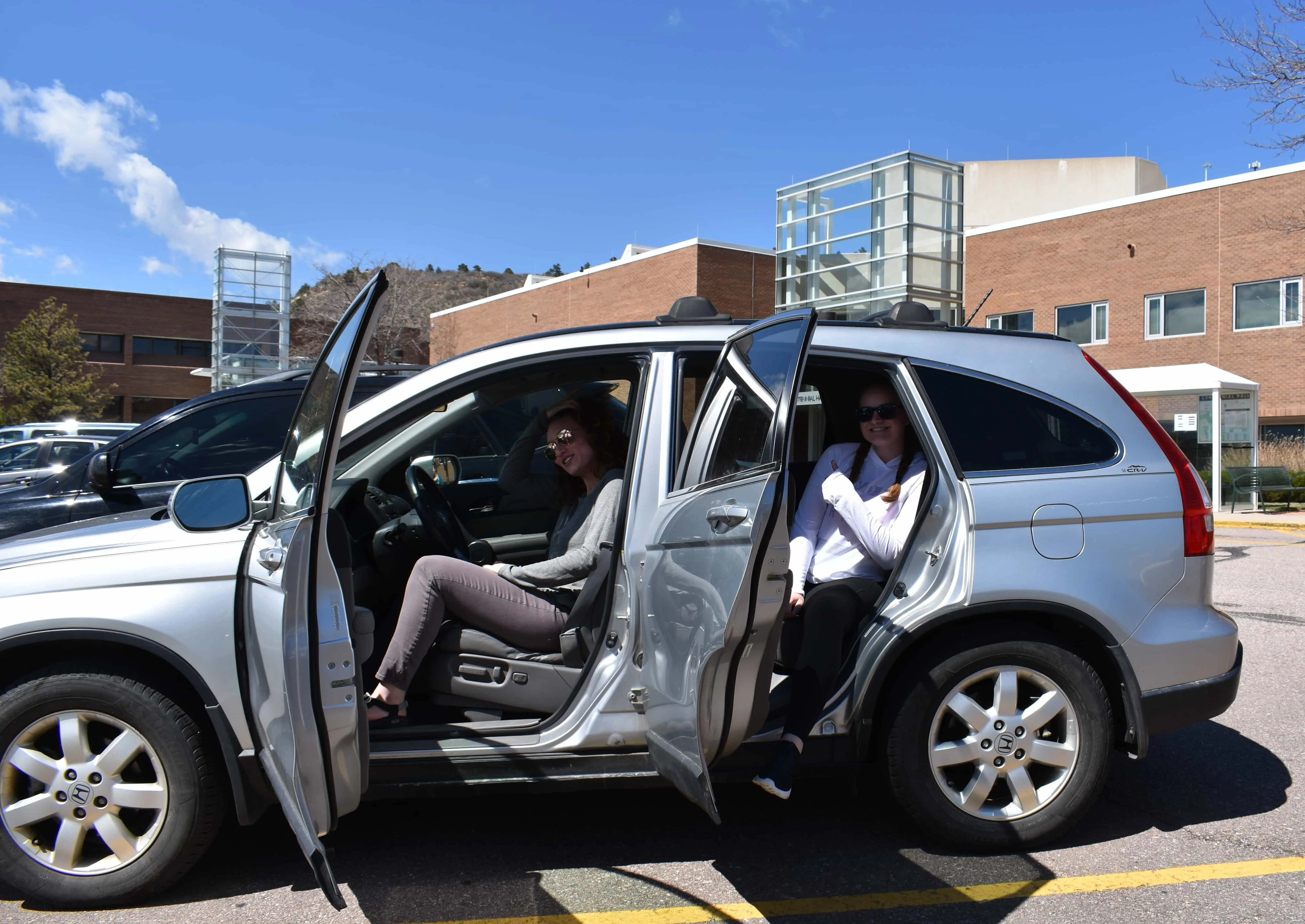 Multiple students leaving a vehicle together