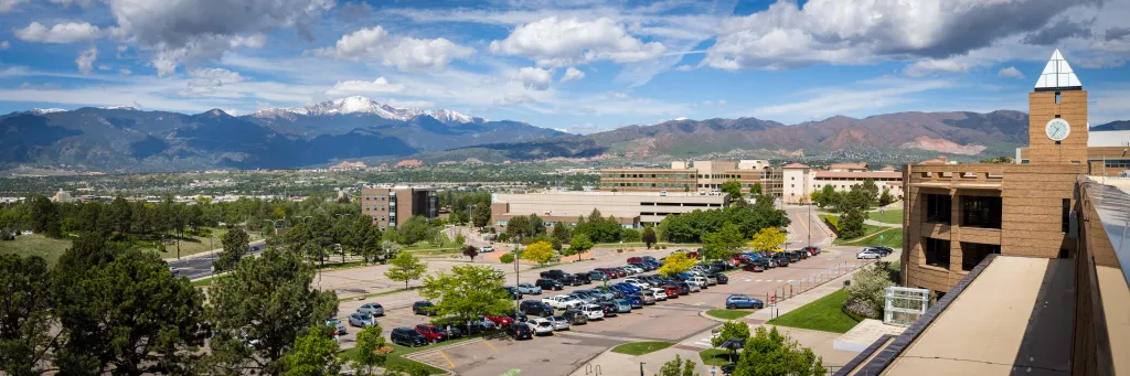 aerial view of campus parking with mountains in the background
